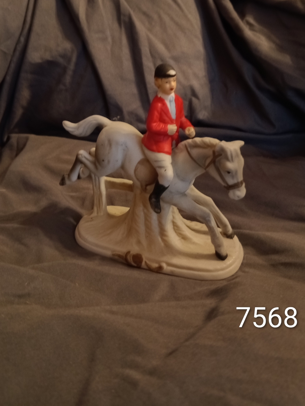 Porcelain Equestrian Figurine with Red Jacket